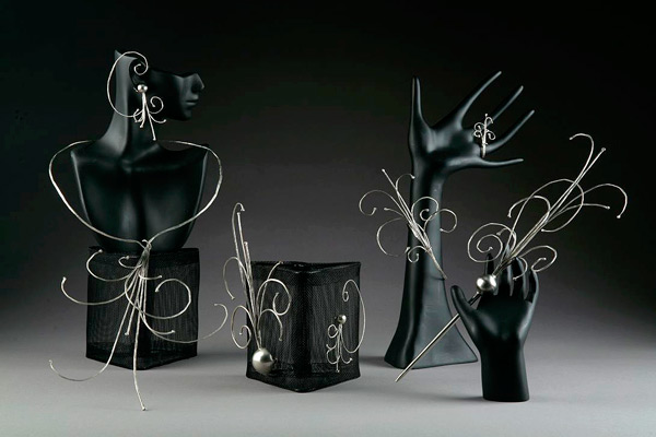 The Particle Decay Series, a set of jewelry by Kristal Feldt, won Best in Show in the 2008 Quadrennial Physics Congress Art Contest.