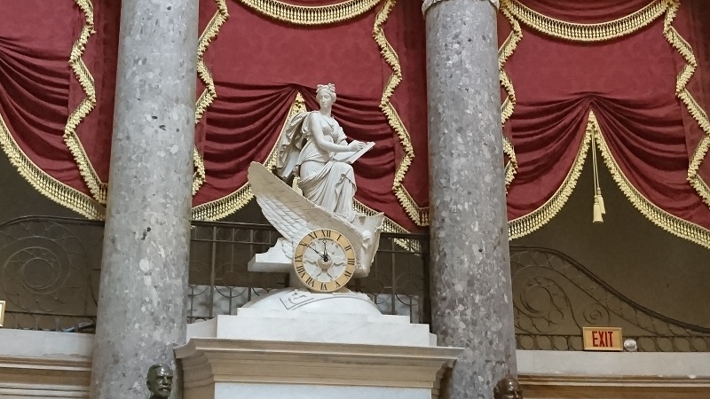 Statue and Pillars on Clock