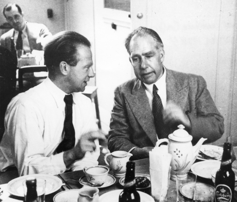 Niels Bohr and Werner Heisenberg converse over drinks at the Bohr Institute Conference in Copenhagen, Denmark. Photograph by Paul Ehrenfest, Jr., courtesy AIP Emilio Segre Visual Archives, Weisskopf Collection