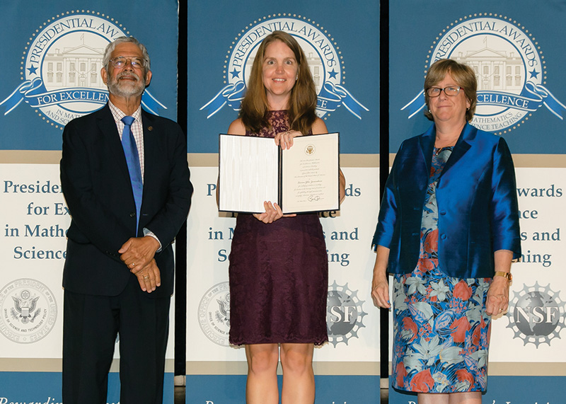 Lauren Zarandona (center) with her presidential certificate, standing between Assistant to the President for Science and Technology and White House Office of Science and Technology Policy Director John P. Holdren and Dr. Joan Ferrini-Mundy, Assistant Director, Directorate for Education and Human Resources, National Science Foundation. Credit - National Science Foundation