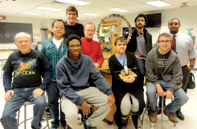 Students from Northern Virginia Community College with their Self-Driven Electromagnetic Wheel.  Photo courtesy of NVCC SPS chapter