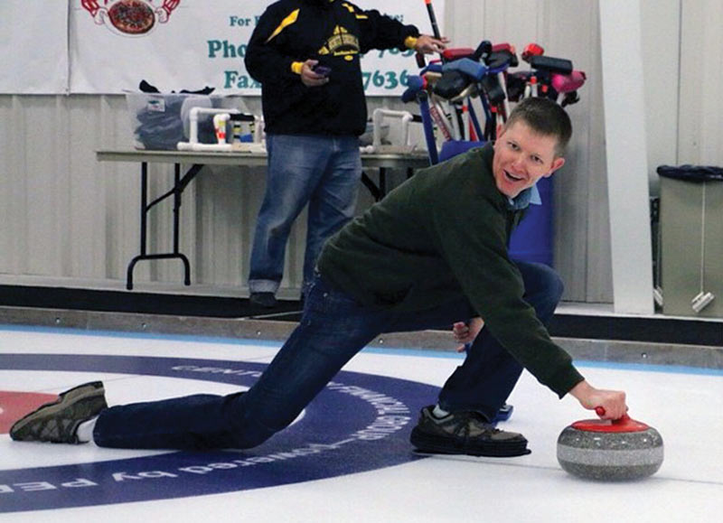 A still shot from a YouTube video shows Destin demonstrating the physics of curling. Photo courtesy of Marquette University SPS chapter.