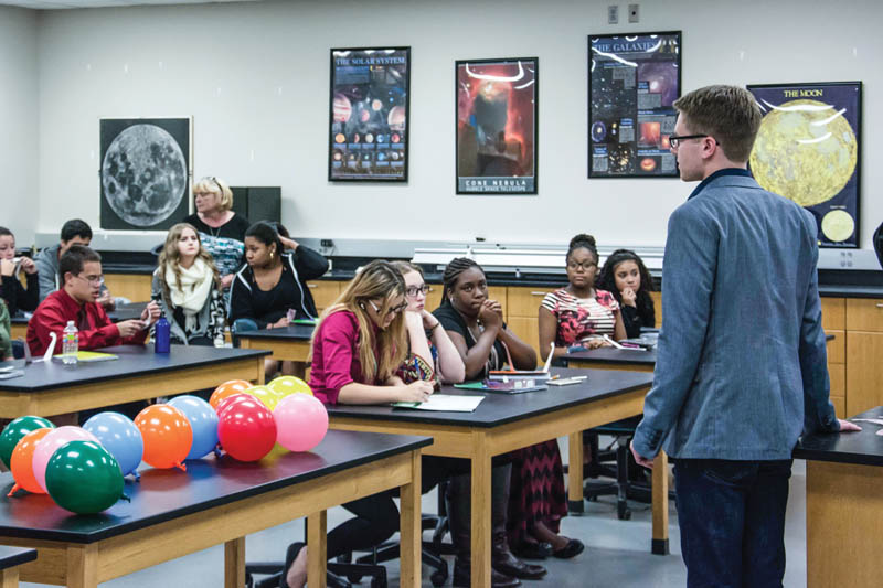 Robertson speaking to a room of students at an on-campus STEM night. Photo by Dominic Critchlow.