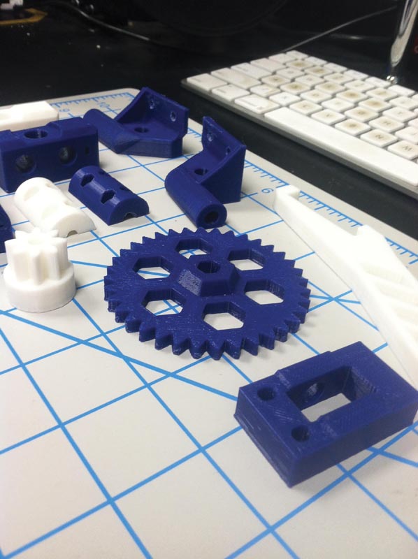 Some of the custom-printed components of the 3D printer.