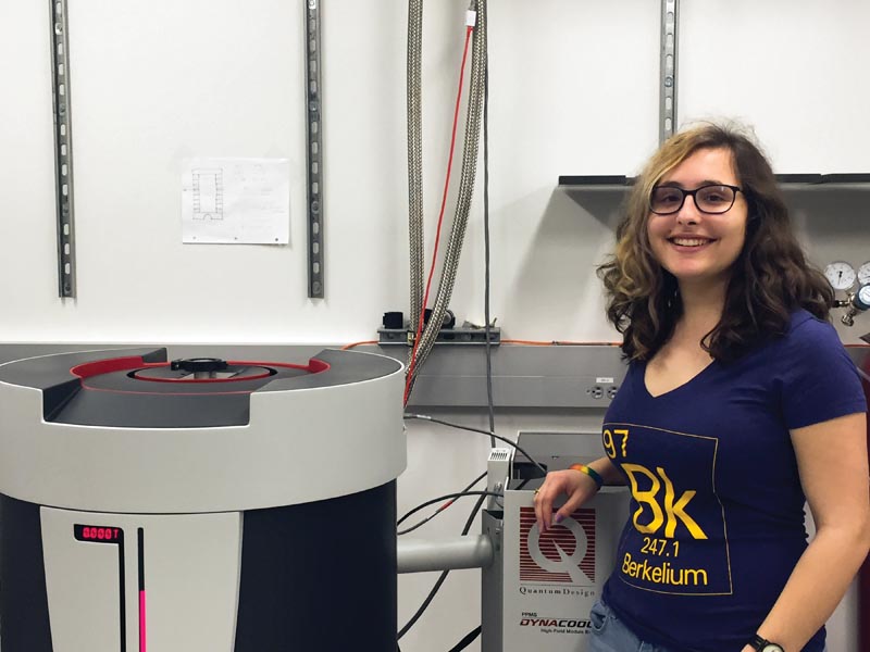 Mayia Vranas in front of her lab's physical property measurement system. Photo courtesy of Mayia Vranas.