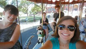 Kirsten, Kelby, Mark, and I embracing our inner childhood on the National Mall carousel.