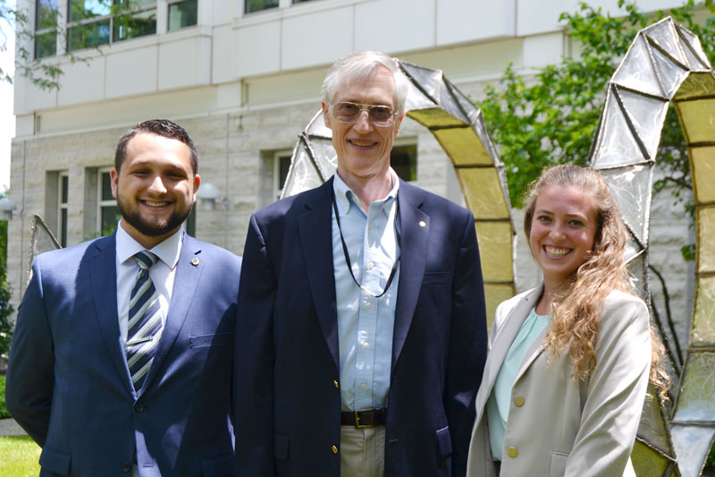 AIP Mather Policy Interns Dimitri Call and Tabitha Colter are pictured with program sponsor Dr. John Mather (center).