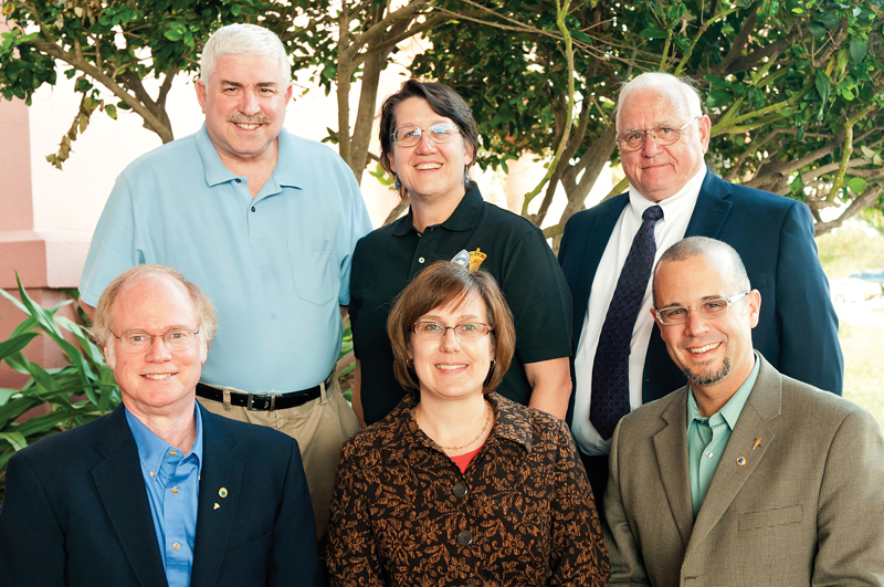 Pictured with *William DeGraffenreid (first row right) at the 2012 Congress are past presidents of Sigma Pi Sigma *Thomas Olsen and Ann Viano (first row), along with *Steve Feller, *Diane Jacobs, and Charles Miner (back row). Photo by Ken Cole. *Members of the 2012 Quadrennial Physics Congress Planning Committee.