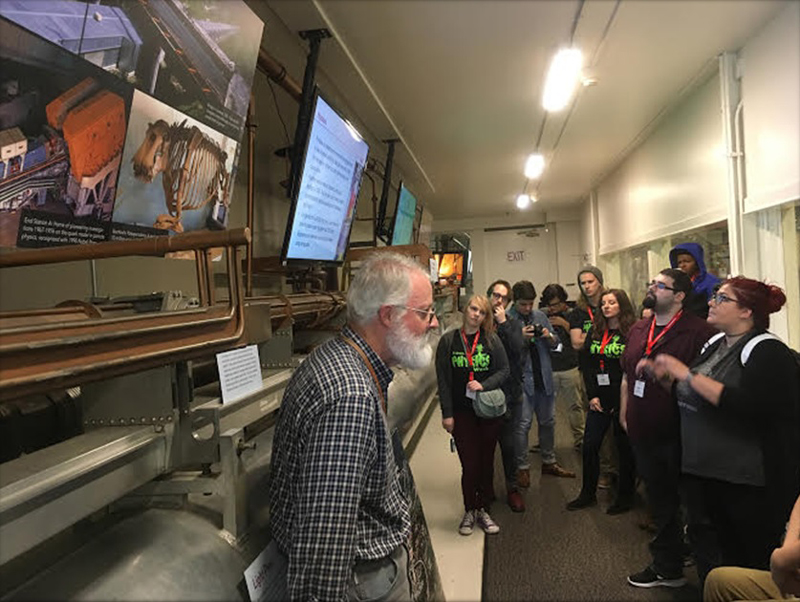 PhysCon attendees listening to a lecture on how the Klystron Gallery works to produce x-ray radiation. Photo courtesy of CSU SPS