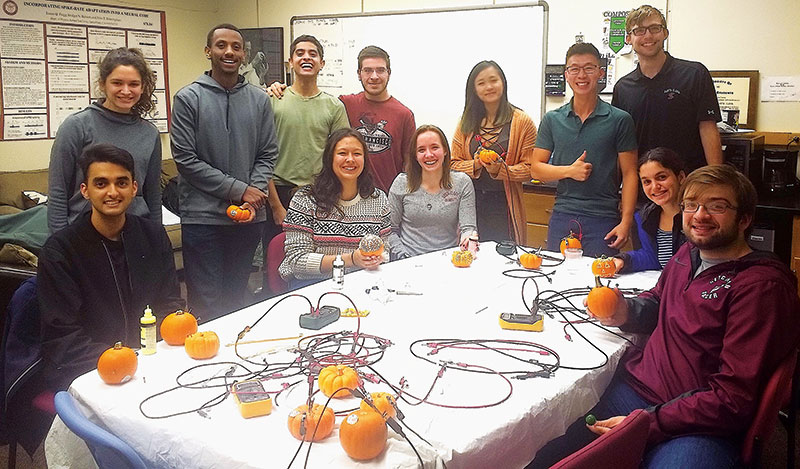 SCU SPS members make batteries from pumpkins. Photo courtesy of the SCU SPS chapter. 