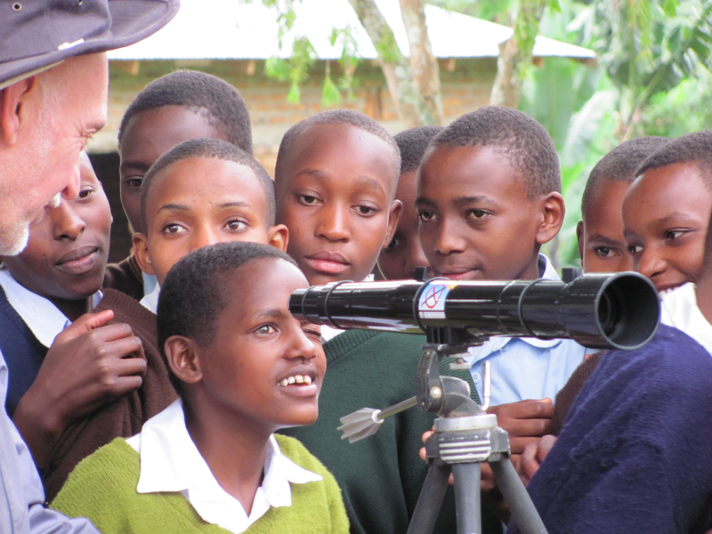 Children in Tanzania using a Galileoscope brought by Chuck Ruehle