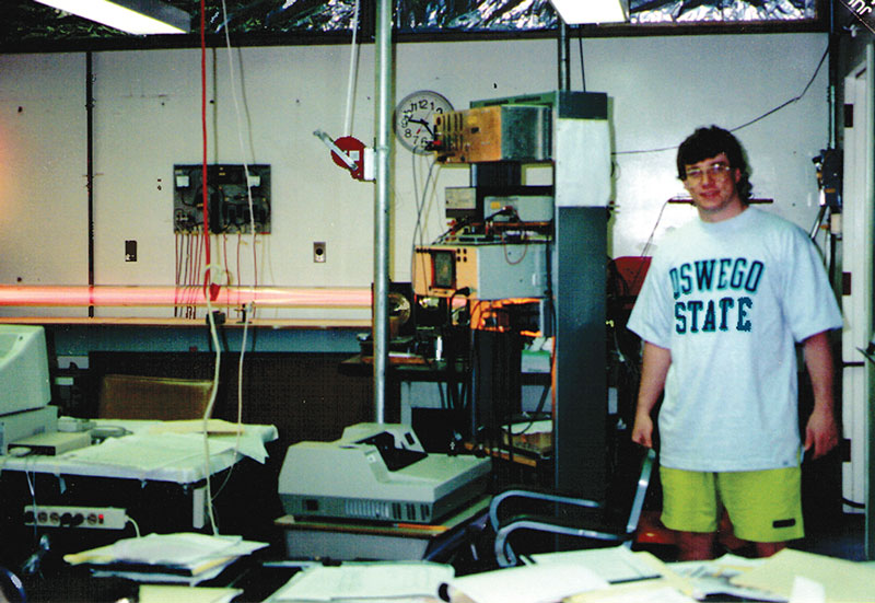 Summer of '92. A young Mike Jackson poses for a photo in the laser spectroscopy lab at SUNY Oswego. Photo by Robert Jackson, Jr.