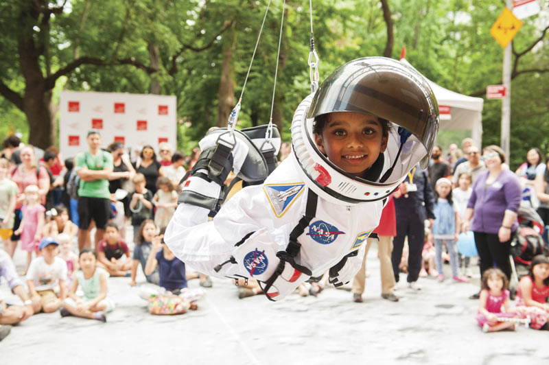Children get the unique opportunity to play astronaut for the day at &quot;Street Science.&quot; Photo courtesy of the World Science Festival.