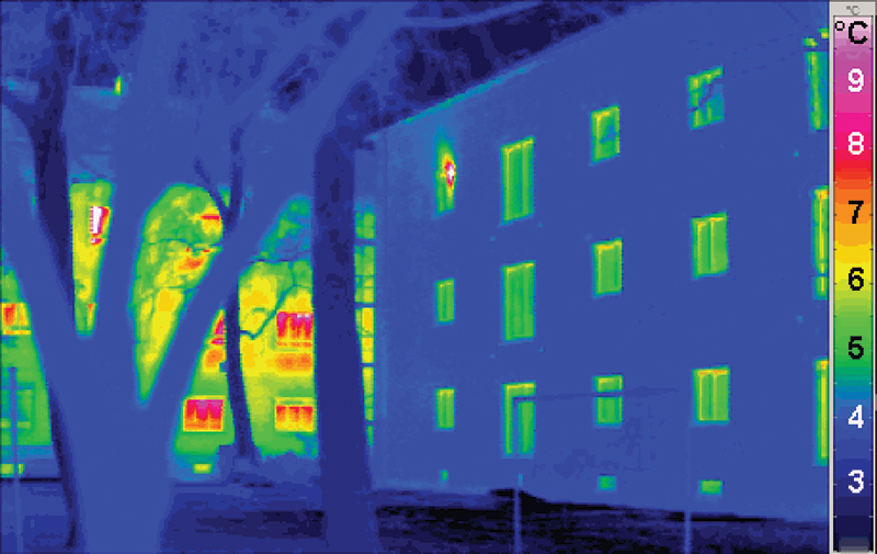 This thermal image contrasts the heat loss of an energy-efficient building (foreground) with a traditional building. Photo credit - Passive House Institute, PHI.