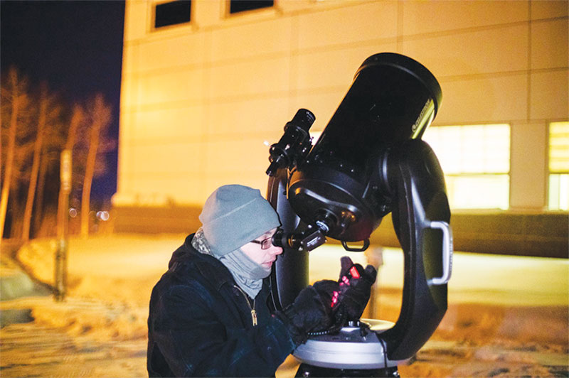 UAF SPS treasurer Austin Cohen aligns a telescope on the Pleiades star cluster at Astropalooza 2 in February 2019. Photo courtesy of Tanya Clayton.