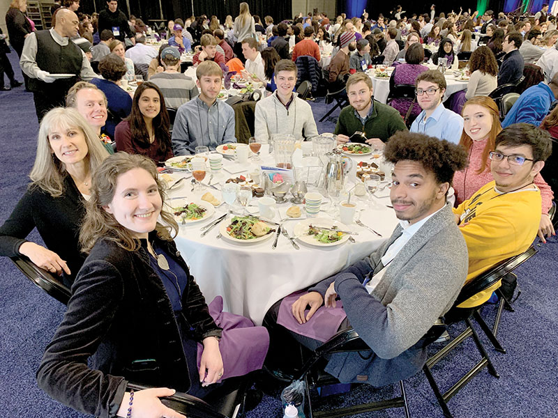 Donna Hammer (farthest left) with members of the UMD chapter at the 2019 Physics Congress. 