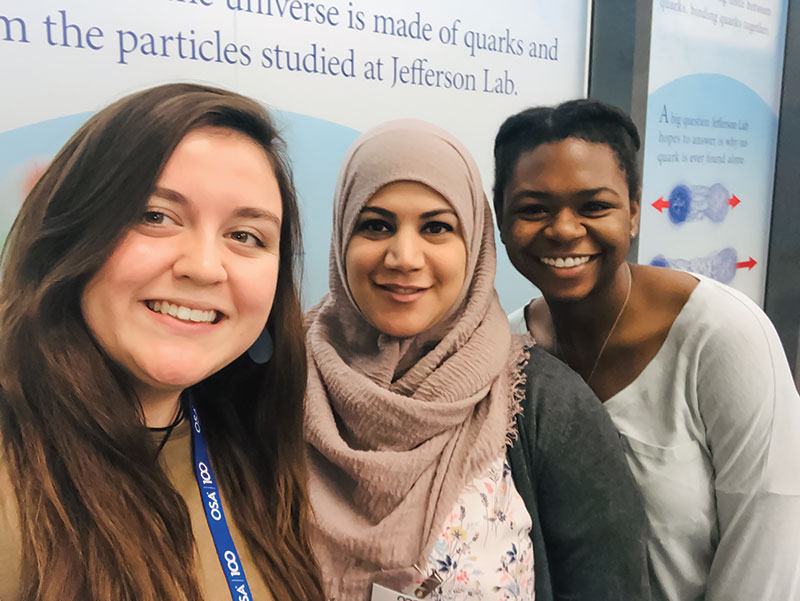 Roanoke College SPS members Adrienne (left) and Rachel (right) at the 2020 Conference for Undergraduate Women in Physics with Dr.     Hiba Assi (center).