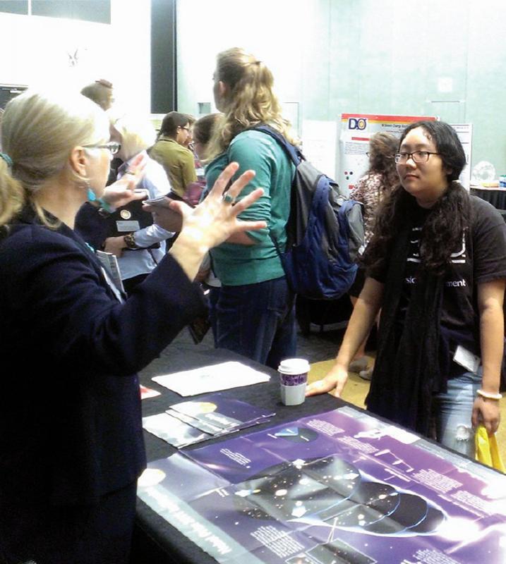 Beth Cunningham, president of AAPT, chats with a student during the meeting’s industry fair. Photo by Lily Udumukwu.