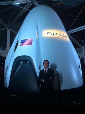 Standing outside the Dragon V2 prototype at the Newseum on June 10, 2014.