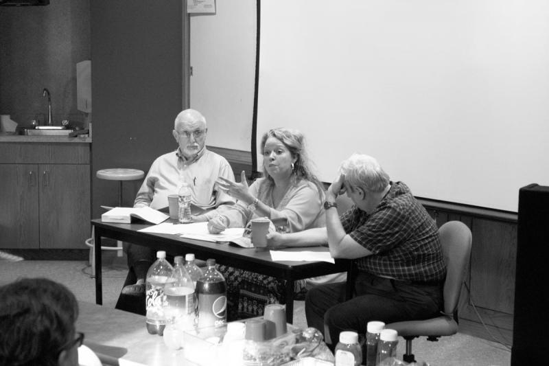 Megan Hickerson speaks about heresy, flanked by David Evans (left) and Jules Mollere (right). Photo by Dillan McNiel.