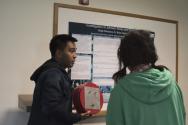 Colorado Mesa Universiy student Saige Dacuycuy (left) presents his research poster.