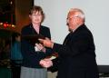 Dr. Karen Williams, left, professor of physics at East Central University, receives the Worth Seagondollar Service Award from Dr. George Miner at the Sigma Pi Sigma Quadrennial Congress in Batavia, Ill.