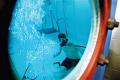 A US Navy sailor trains in the submarine escape trainer at the Navy Submarine School on Naval Submarine Base New London. Photo credit: DoD. The appearance of US Department of Defense (DoD) visual information does not imply or constitute DoD endorsement.