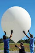  Volunteers assist with a high-altitude balloon launch.