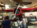 Gloria Huynh and Kery Brady learning about Amelia Earhart's plane, the Lockheed Vega, at the Air and Space Museum.