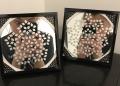 A couple of smaller mirrors that are a part of a collection. They're an artistic interpretation of quasicrystals. Ask Sam Pedek about them!